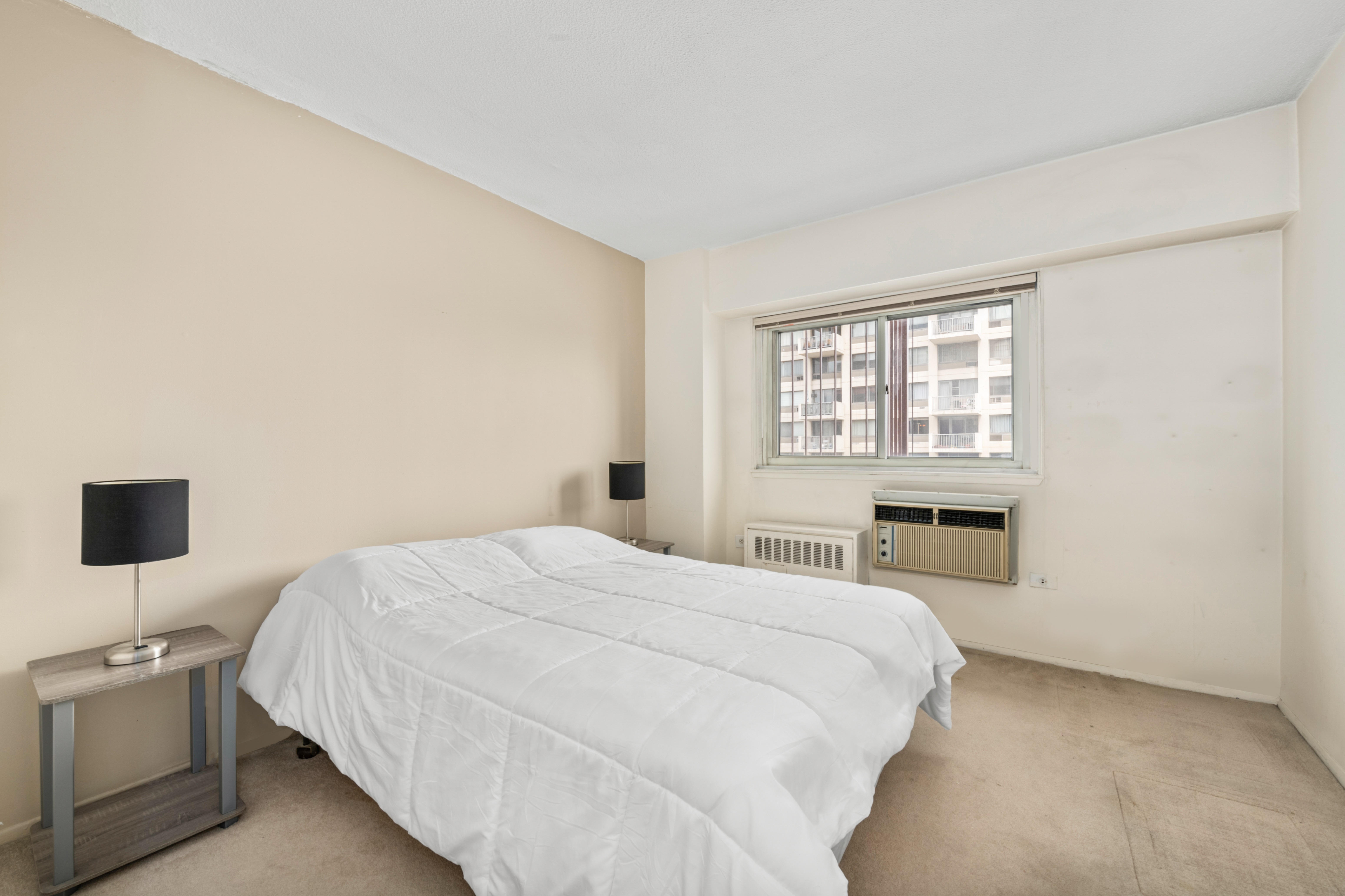609 Columbus Avenue, Unit 14C Manhattan, NY 10024 - Photo 7 of 8 a bedroom with a bed and a tv