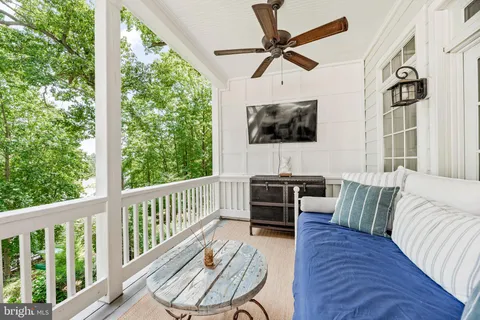 a spacious bedroom with a large bed and a large window