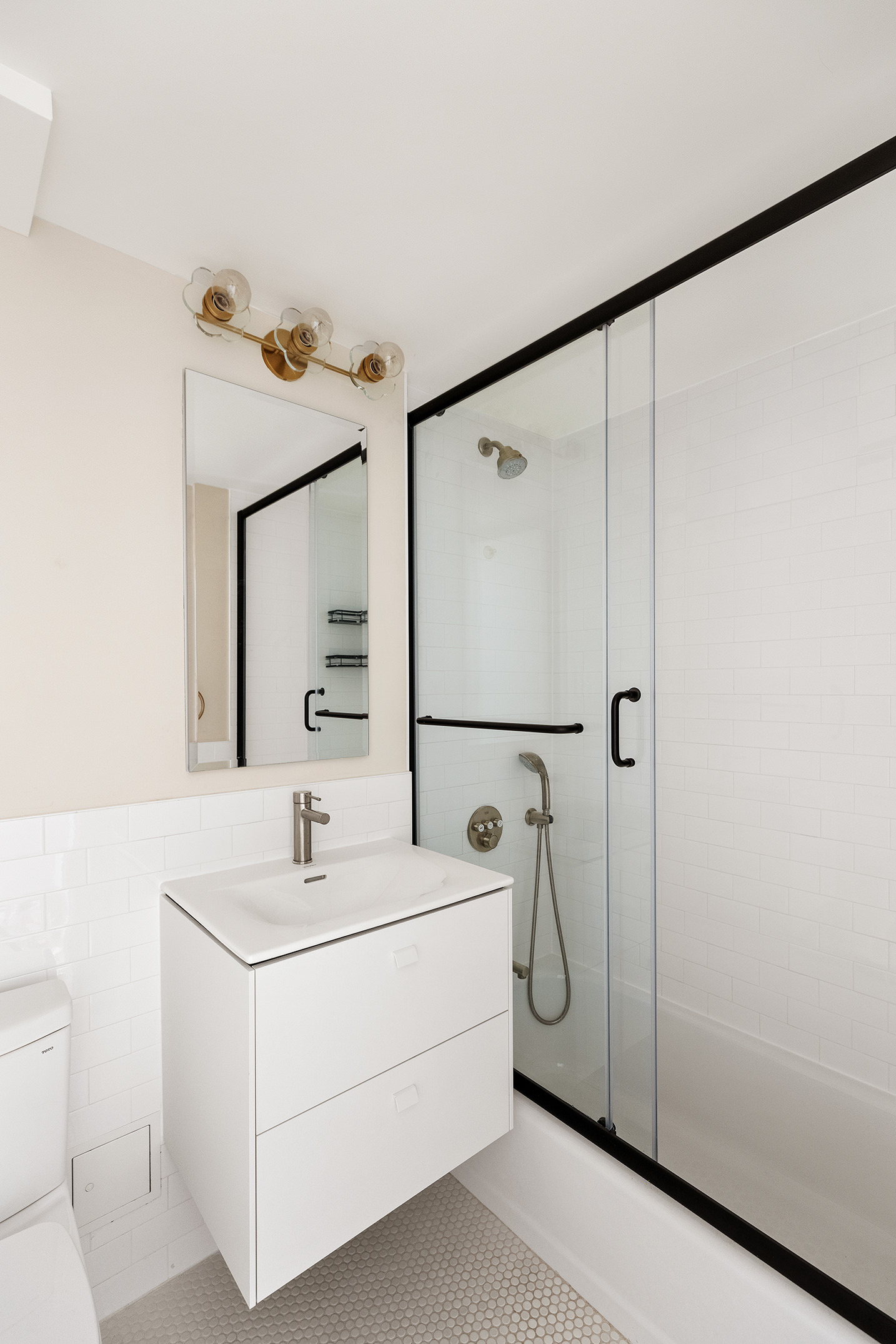 209 Clinton Avenue, Unit 2BC Brooklyn, NY 11205 - Photo 10 of 13 a bathroom with a sink and a mirror
