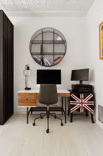 a living room with furniture a rug and a wall painting