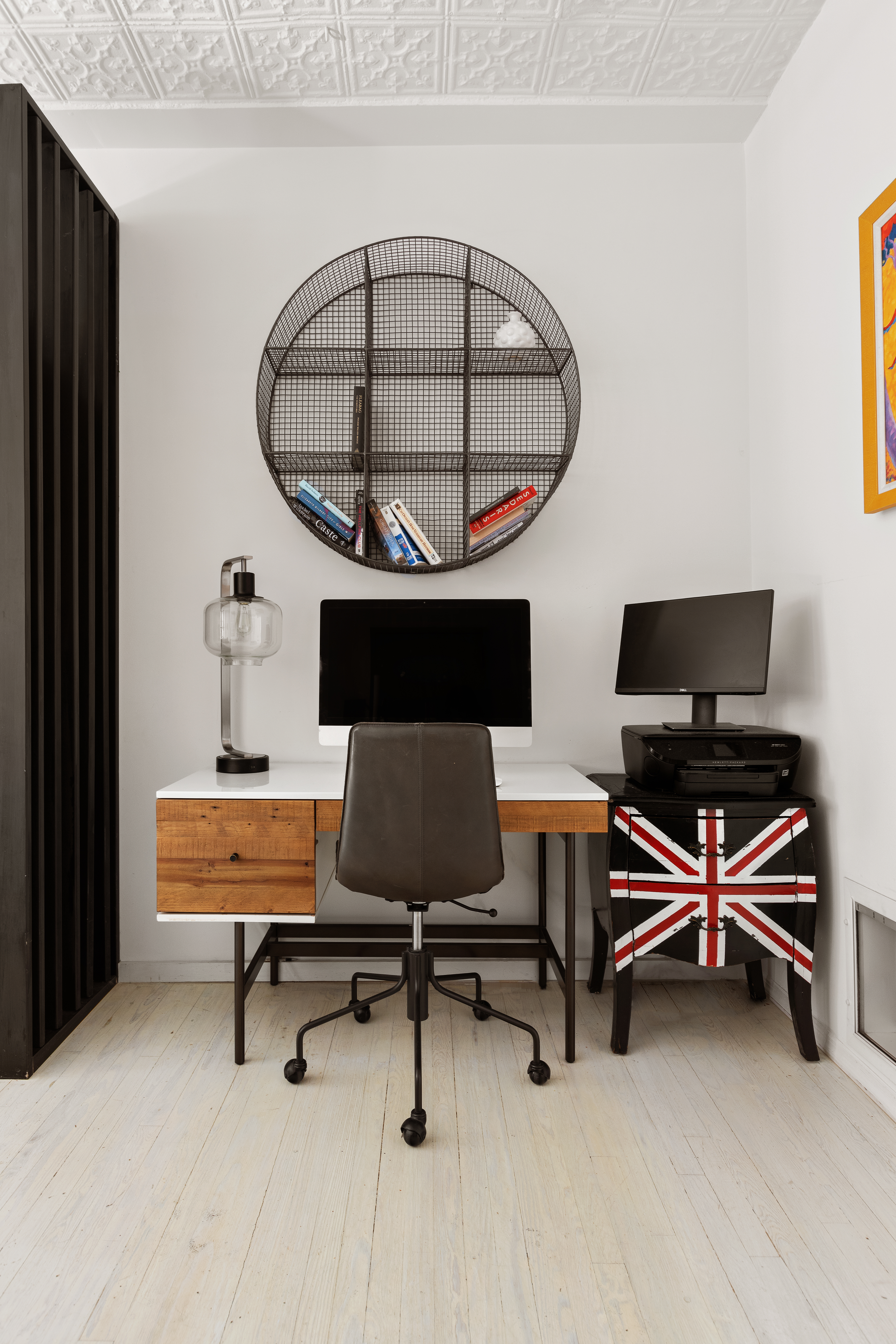 133-131 West 28th Street, Unit 7A Manhattan, NY 10001 - Photo 6 of 11 a living room with furniture a rug and a wall painting