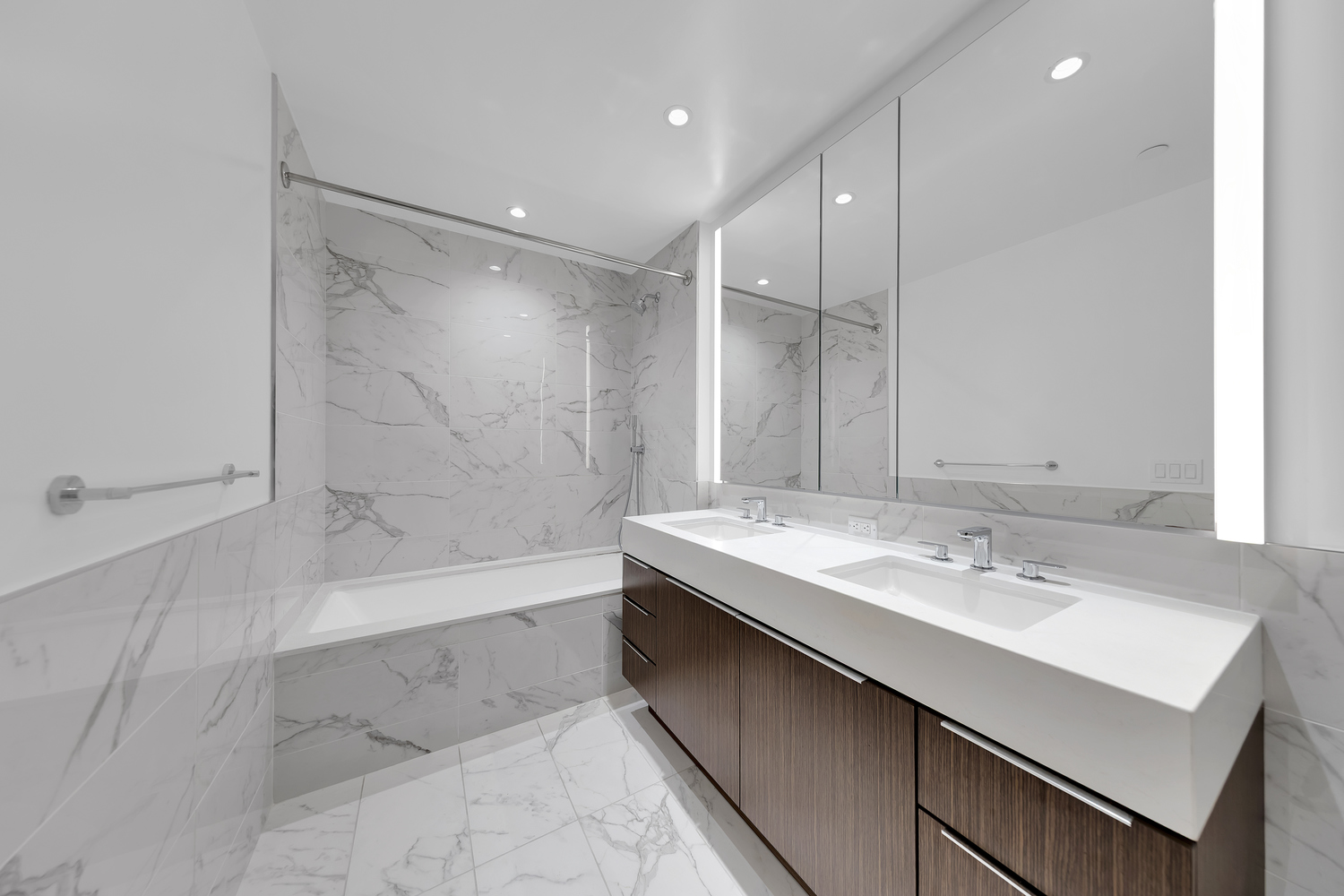 30 Riverside Boulevard, Unit 1414 Manhattan, NY 10069 - Photo 6 of 25 a bathroom with a bathtub shower sink and mirror