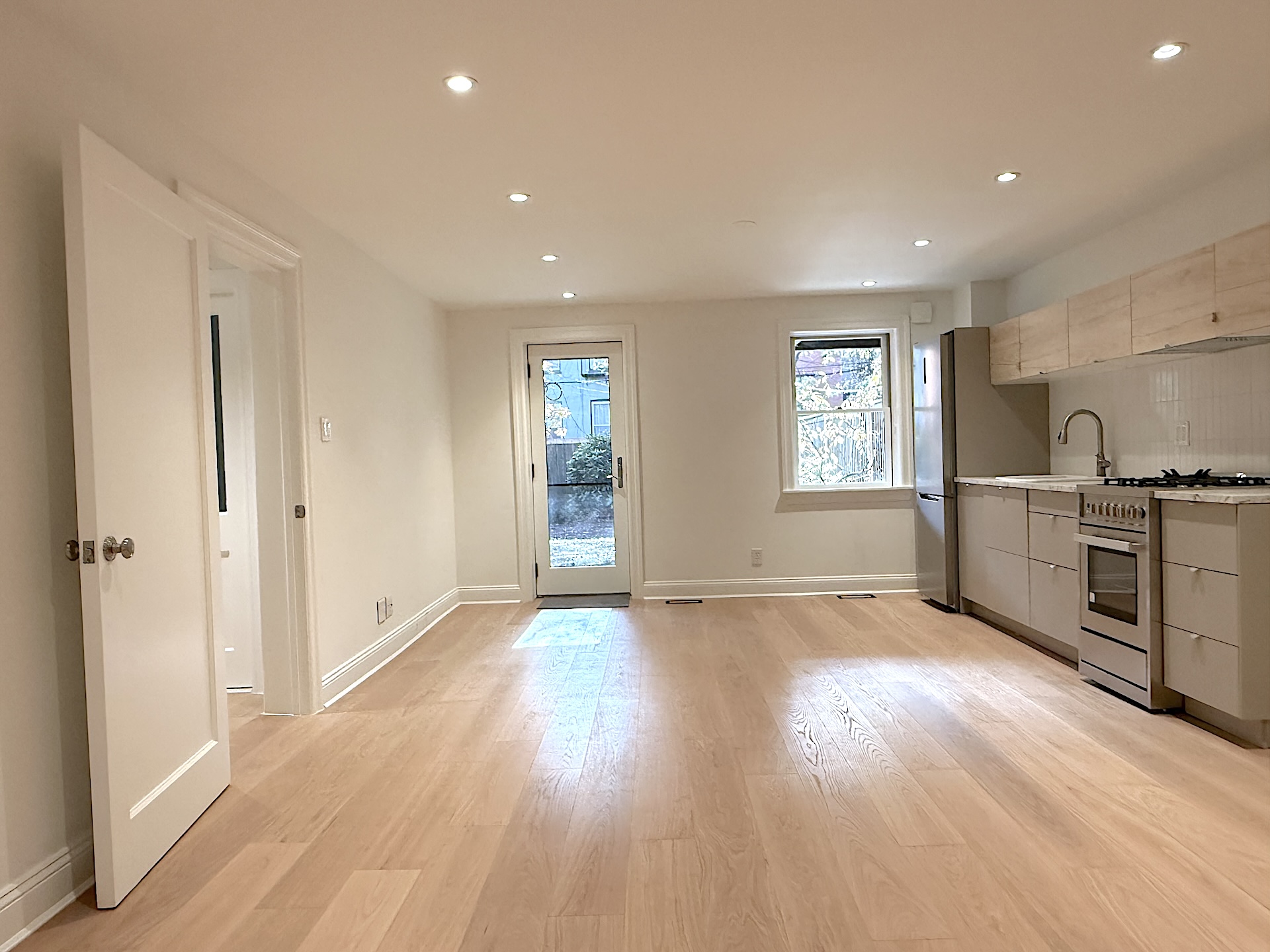 424 Pacific Street, Unit GARDEN Brooklyn, NY 11217 - Photo 6 of 16 a view of an empty room with window and wooden floor
