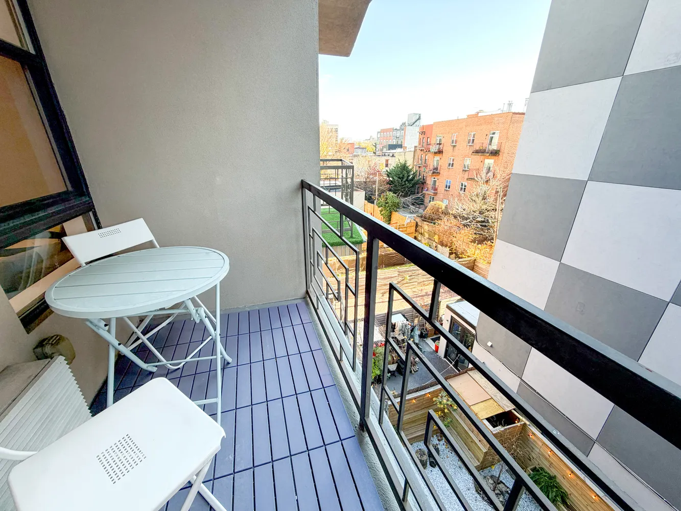 a view of balcony with wooden floor and bench