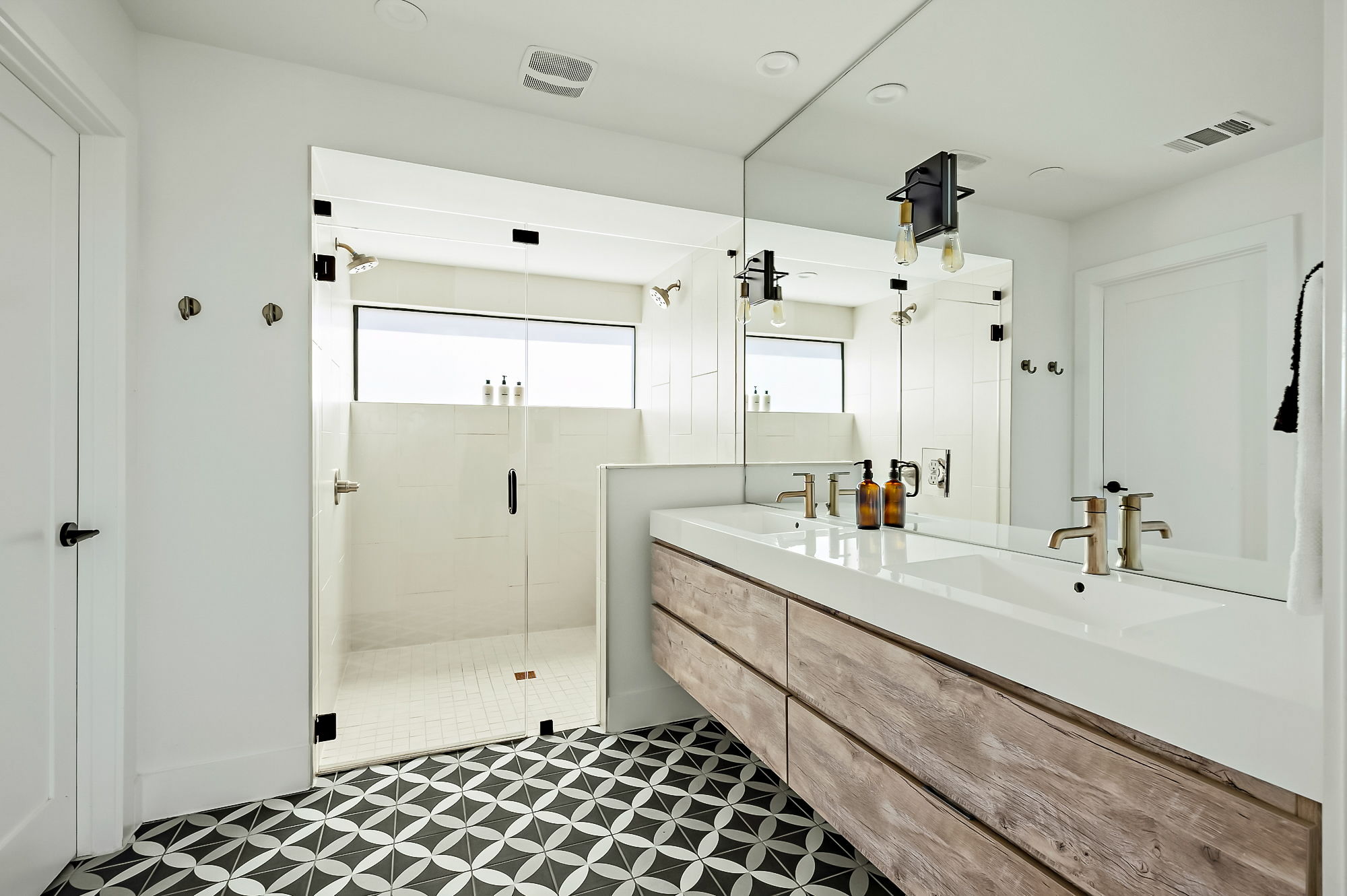 2201 Santa Rosa Street Austin, TX 78702 - Photo 23 of 47 a bathroom with a double vanity sink mirror and shower