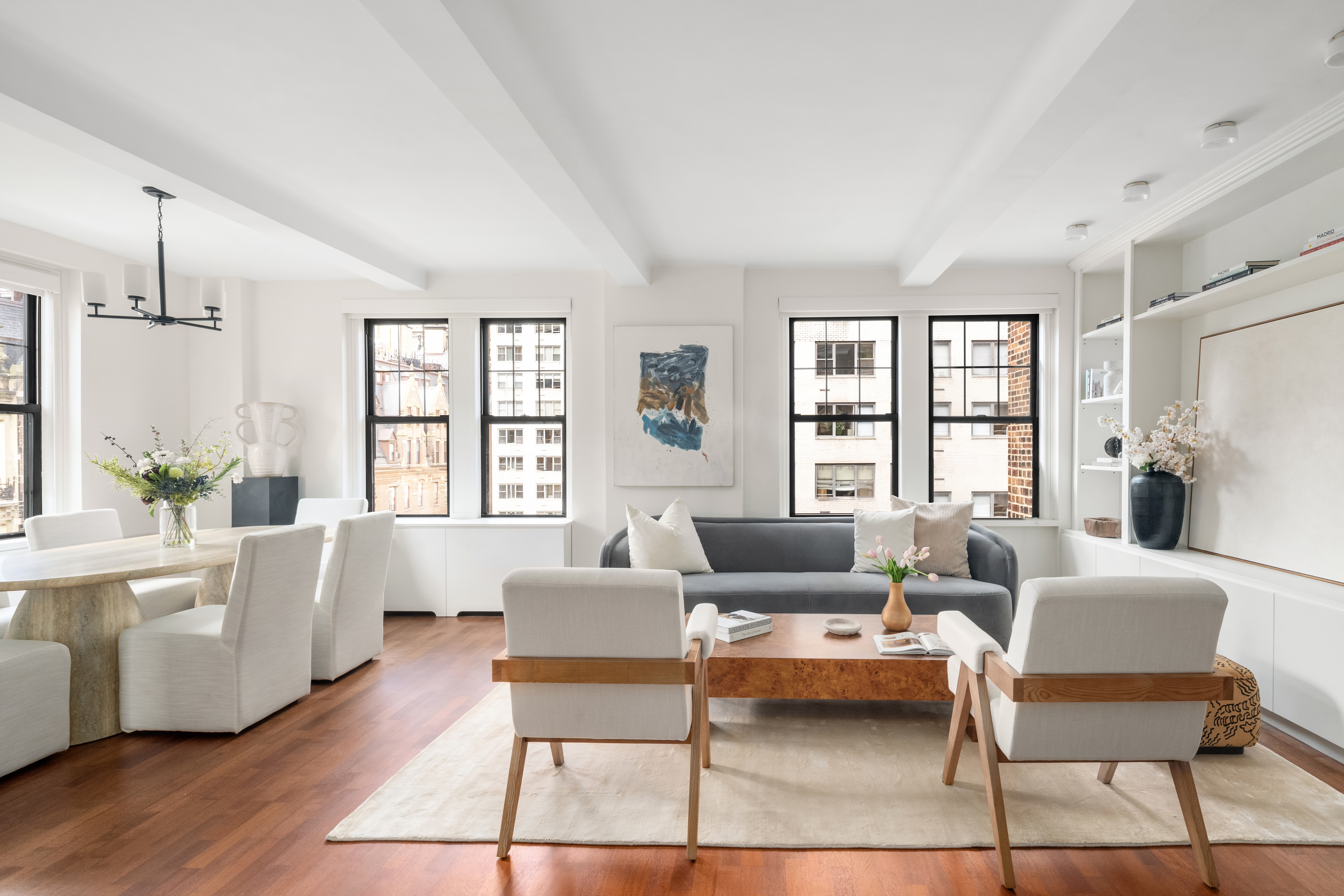 23 West 73rd Street, Unit 1001 Manhattan, NY 10023 - Photo 2 of 14 a living room with furniture and a large window
