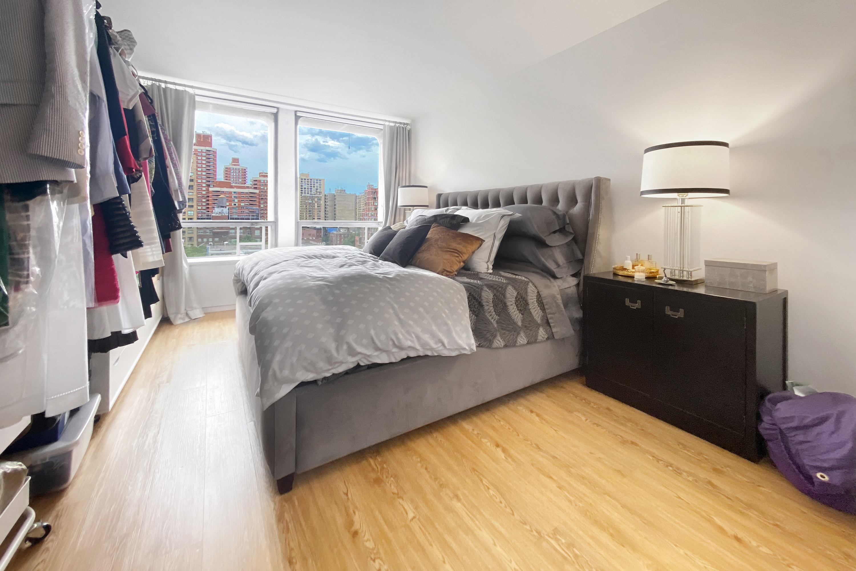 300 East 33rd Street, Unit 10A Manhattan, NY 10016 - Photo 5 of 14 a bed room with a bed and a flat tv screen on a dresser