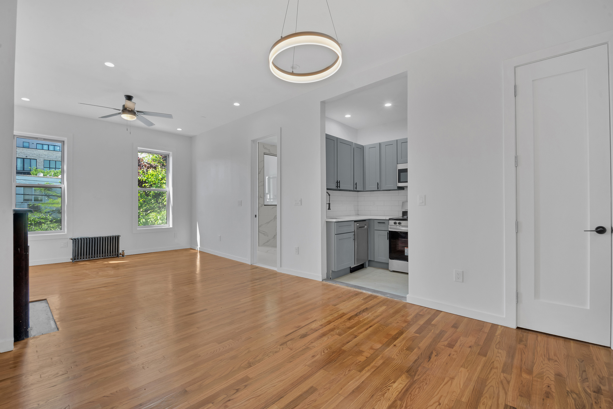 1275 Jefferson Avenue, Unit 2 Brooklyn, NY 11221 - Photo 7 of 11 a view of an empty room with window and wooden floor