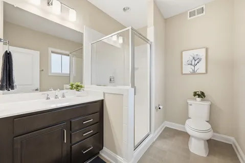 a bathroom with a sink double vanity and a mirror
