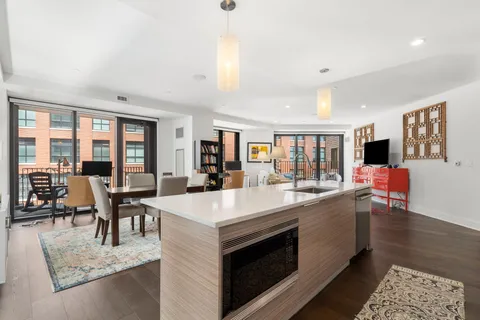 a large kitchen with kitchen island a island in it