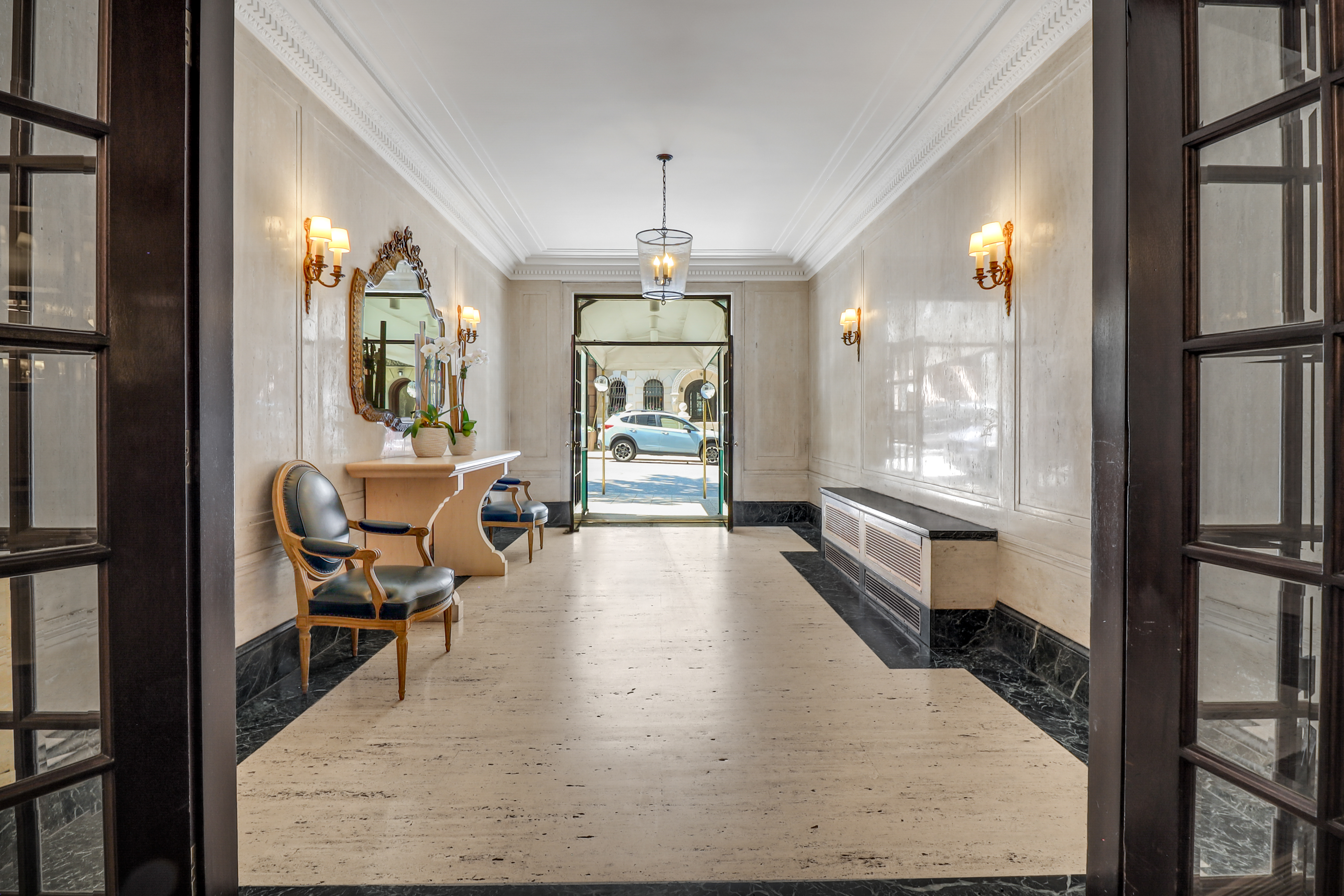 50 Riverside Drive, Unit 5E Manhattan, NY 10024 - Photo 15 of 22 a living room with furniture and a chandelier