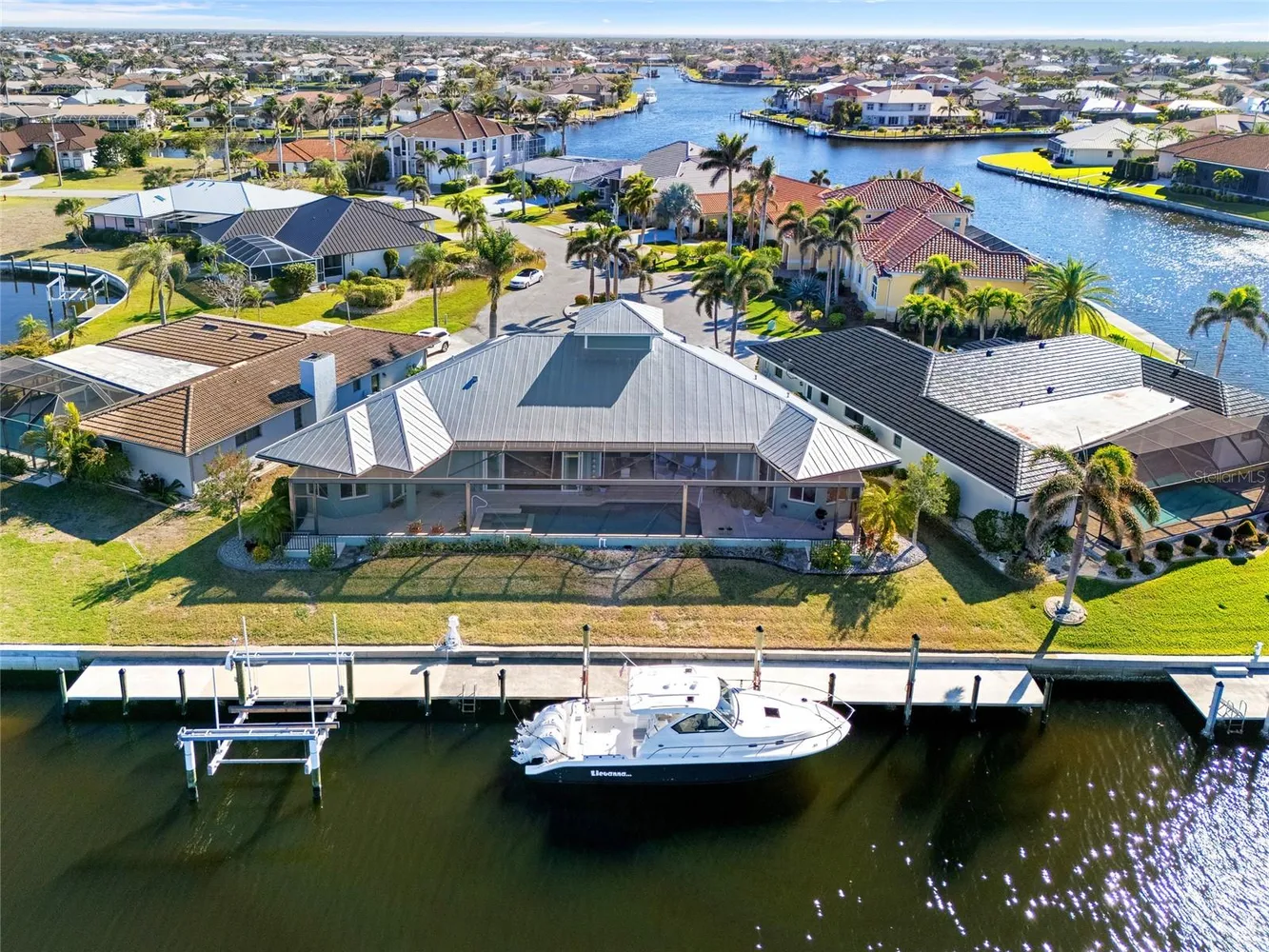 an aerial view of a house with a table and chairs
