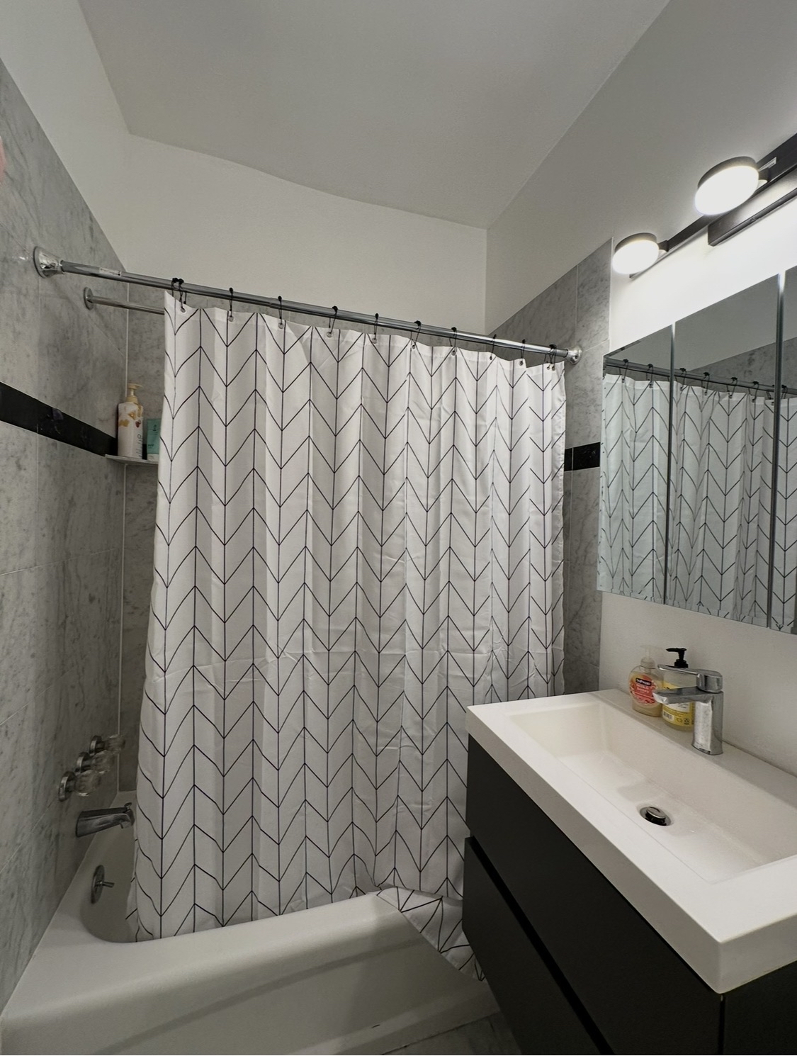 114 East 37th Street, Unit 3A Manhattan, NY 10016 - Photo 11 of 15 a bathroom with a sink and a mirror