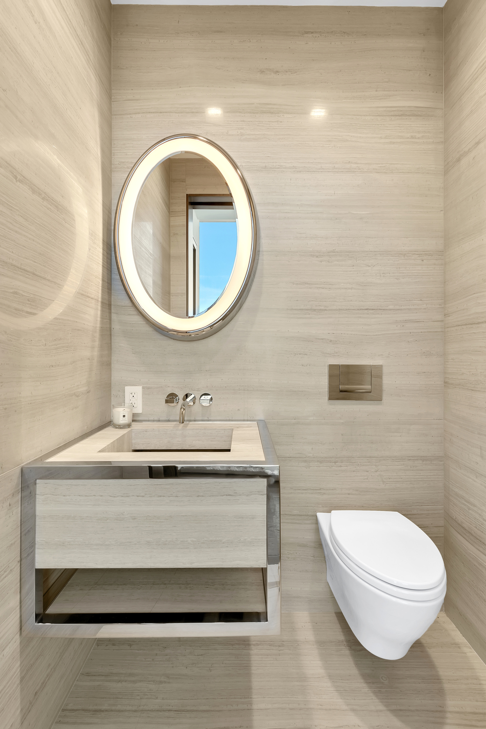 23 East 22nd Street, Unit PH Manhattan, NY 10010 - Photo 19 of 32 a bathroom with a sink a toilet and a mirror