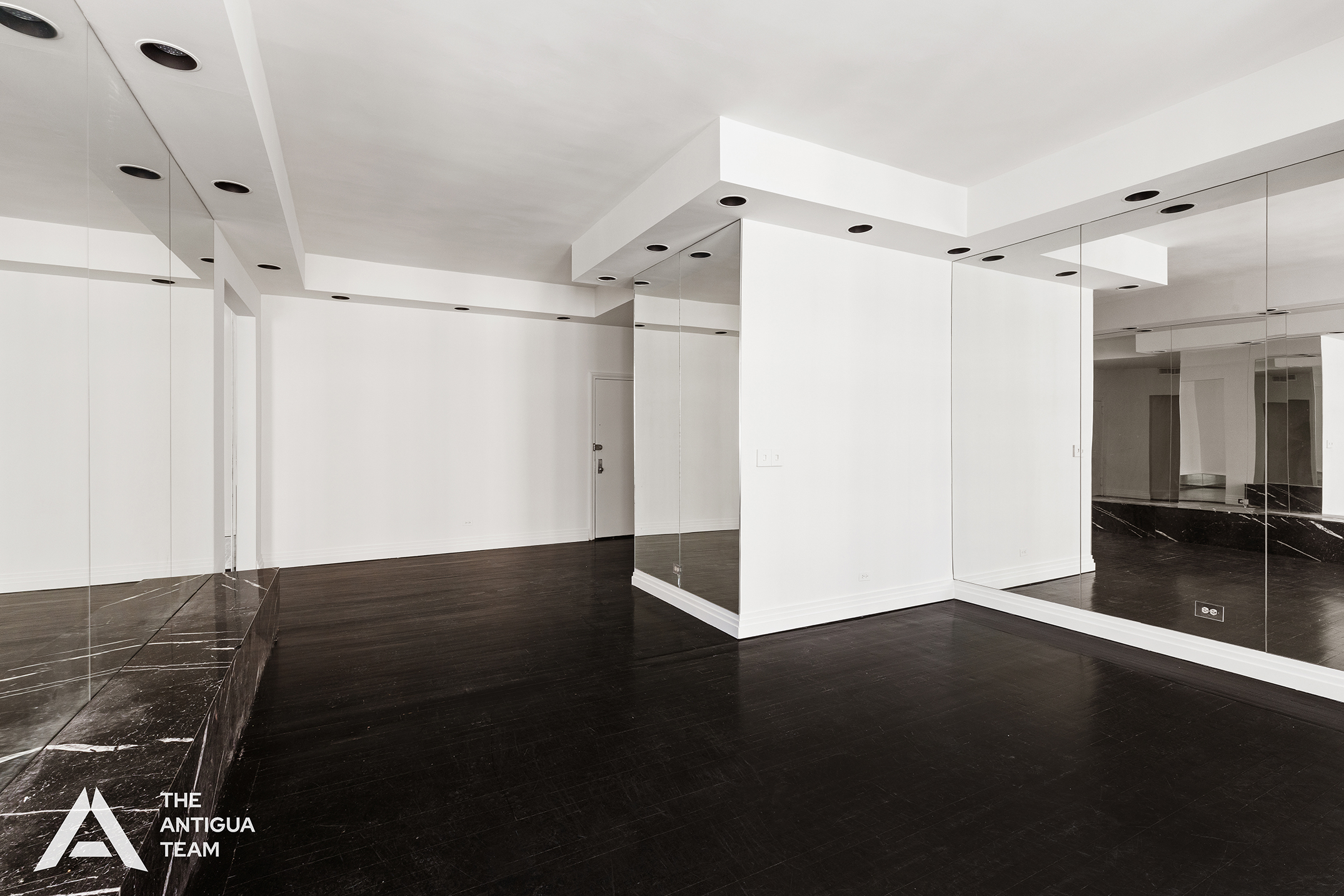45 East 66th Street, Unit 4W Manhattan, NY 10065 - Photo 5 of 27 a view of an empty room with wooden floor and a window