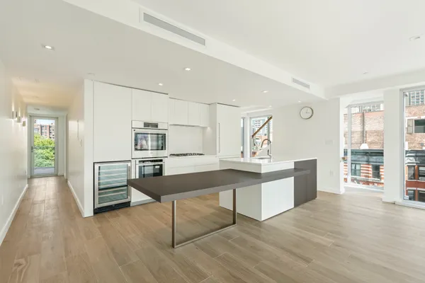 a room with furniture and a wooden floor