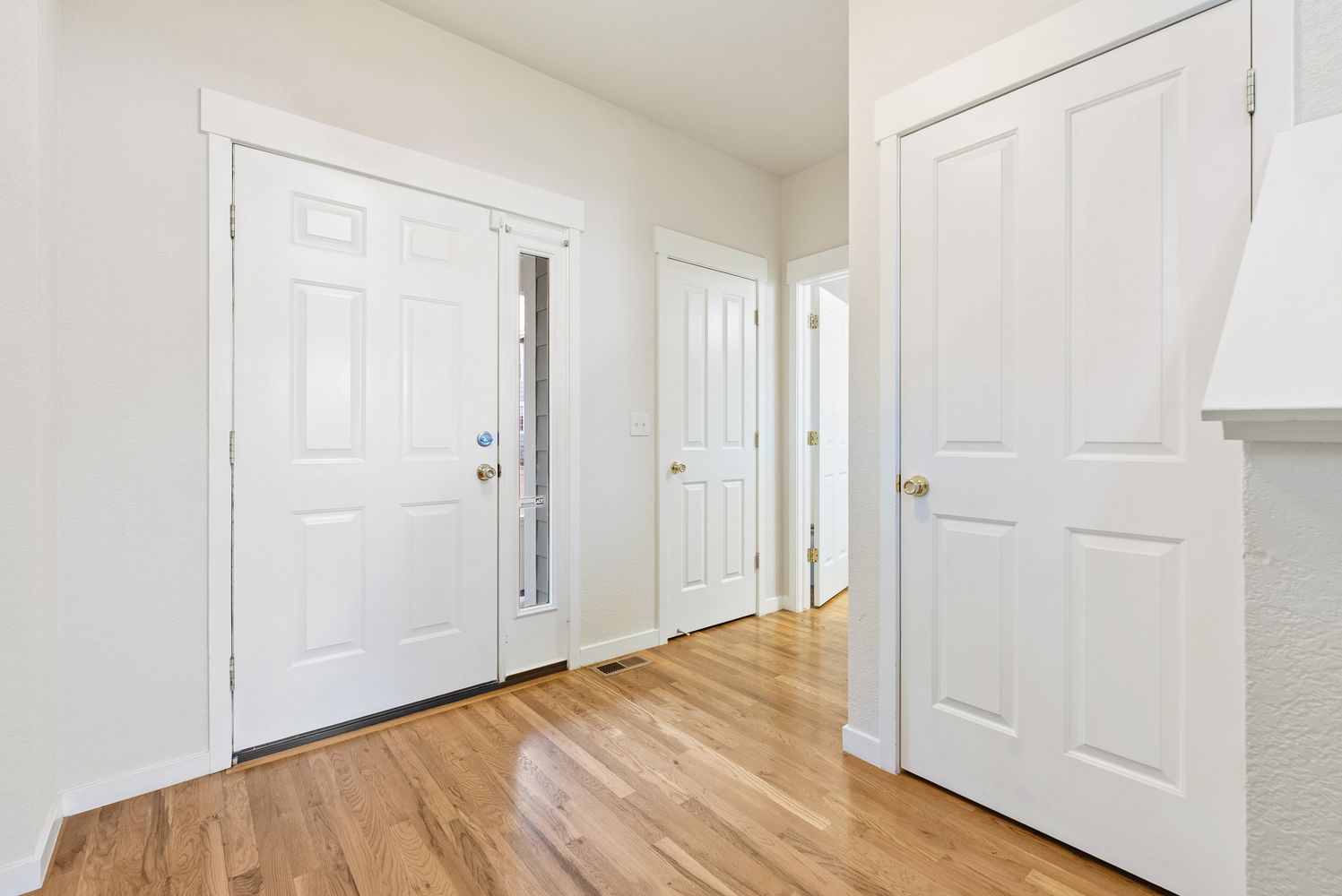 an empty room with wooden floor