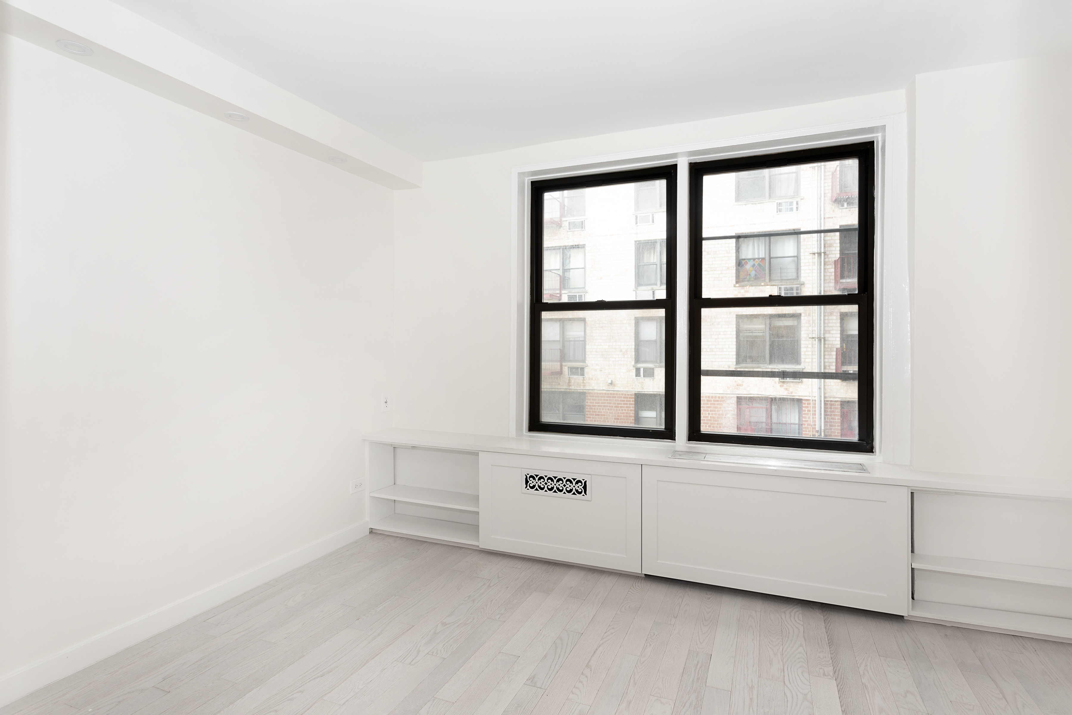 165 Christopher Street, Unit 1C Manhattan, NY 10014 - Photo 7 of 10 a view of an empty room with a window