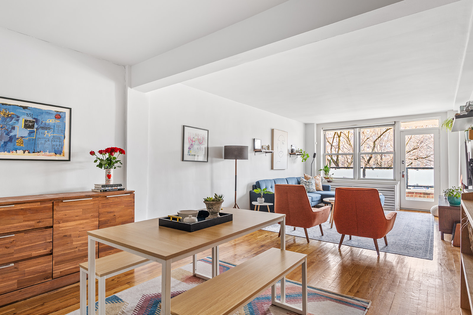 a dining room with furniture and window