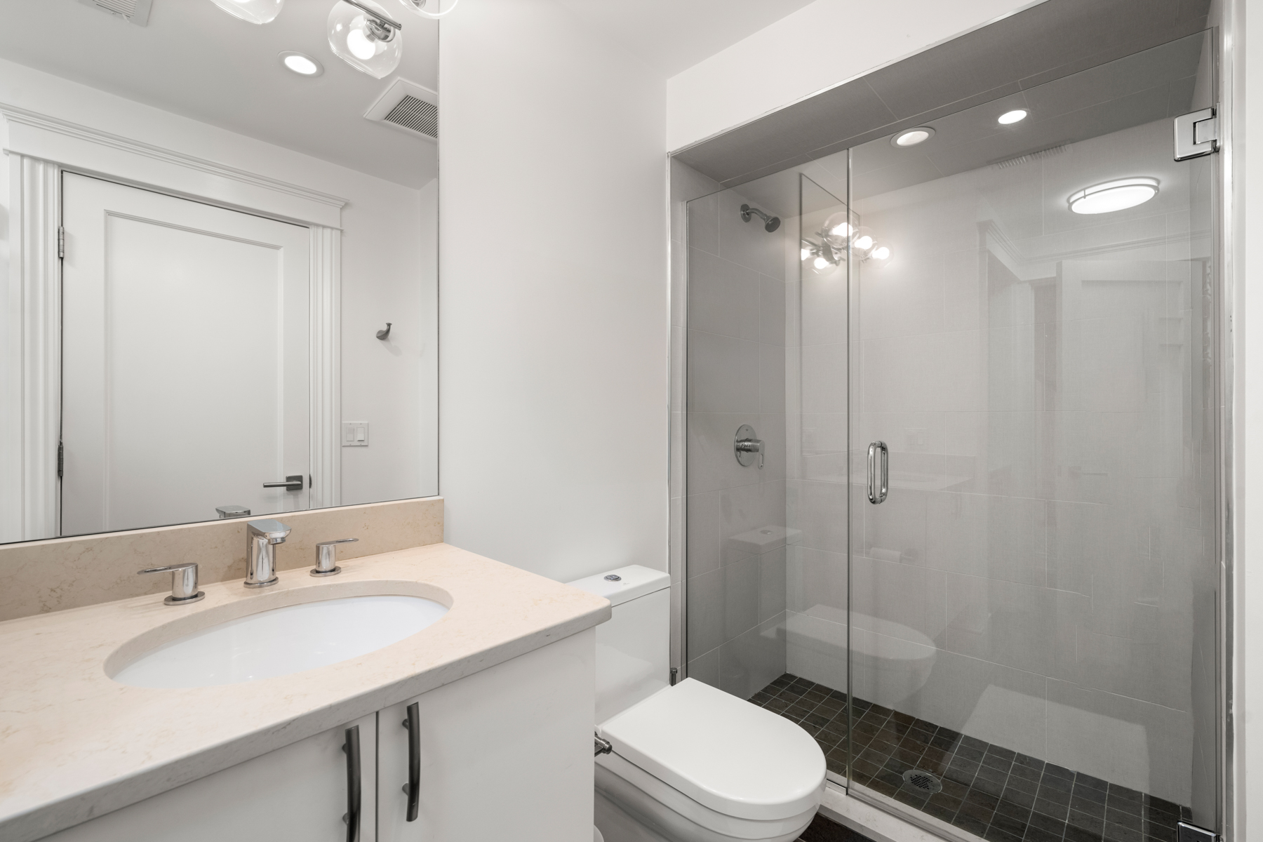 34 Dwight Street, Unit 1 Boston, MA 02118 - Photo 26 of 33 a bathroom with a sink toilet a mirror and shower