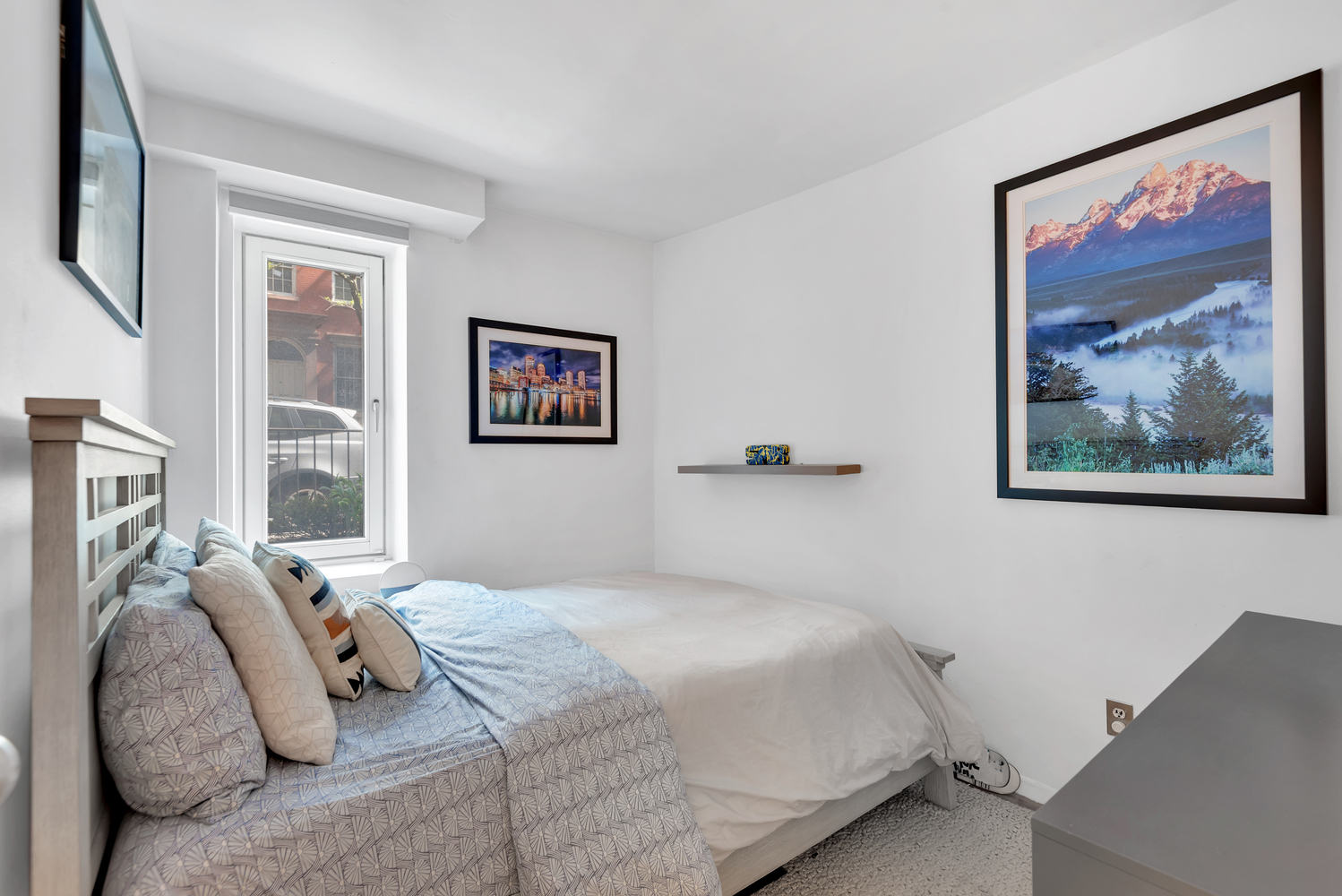 220 West 15th Street, Unit 1A Manhattan, NY 10011 - Photo 3 of 6 a bedroom with bed and painting on the wall