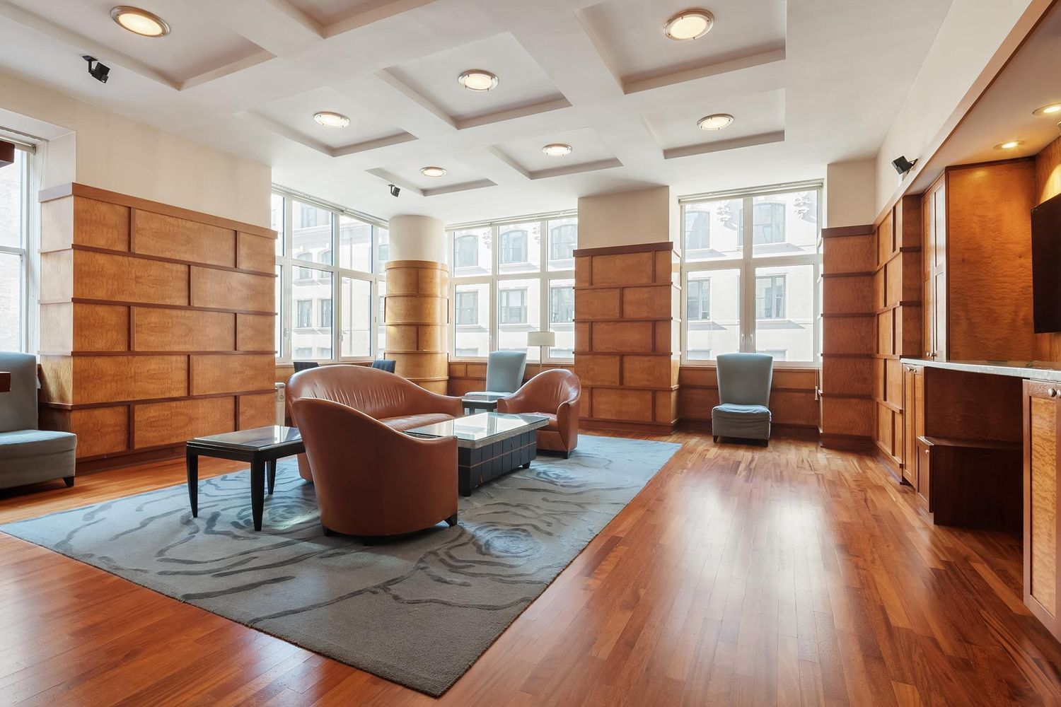 425 5th Avenue, Unit 23D Manhattan, NY 10016 - Photo 18 of 20 a living room with furniture and wooden floor