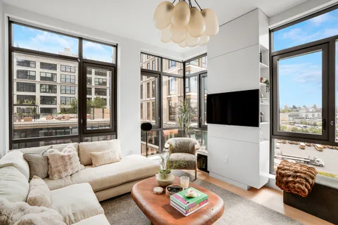 a living room with furniture fireplace and a flat screen tv