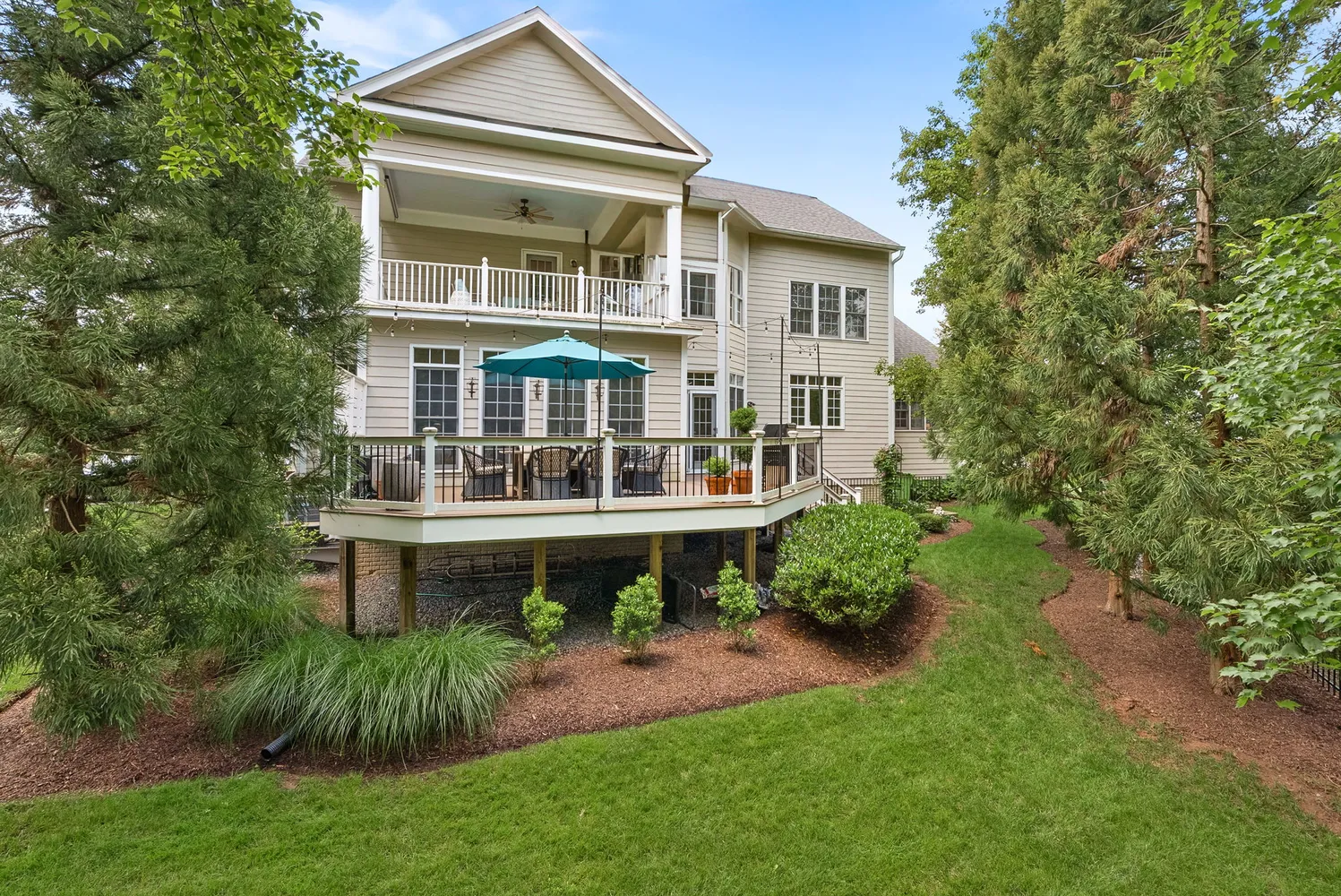 a aerial view of a house with a yard and sitting area