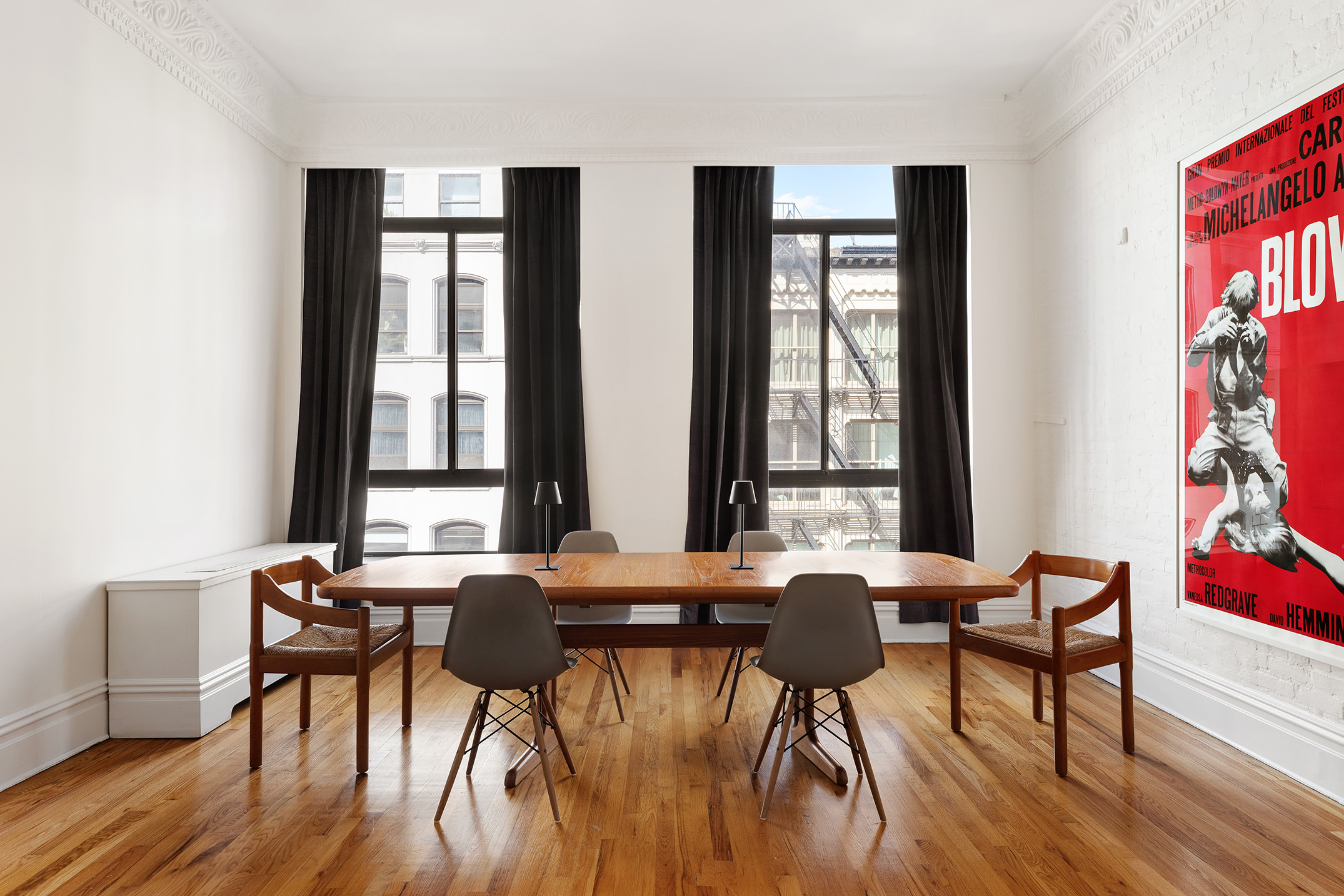 99 Reade Street, Unit 4E Manhattan, NY 10013 - Photo 3 of 11 a view of a dining room with furniture and a window