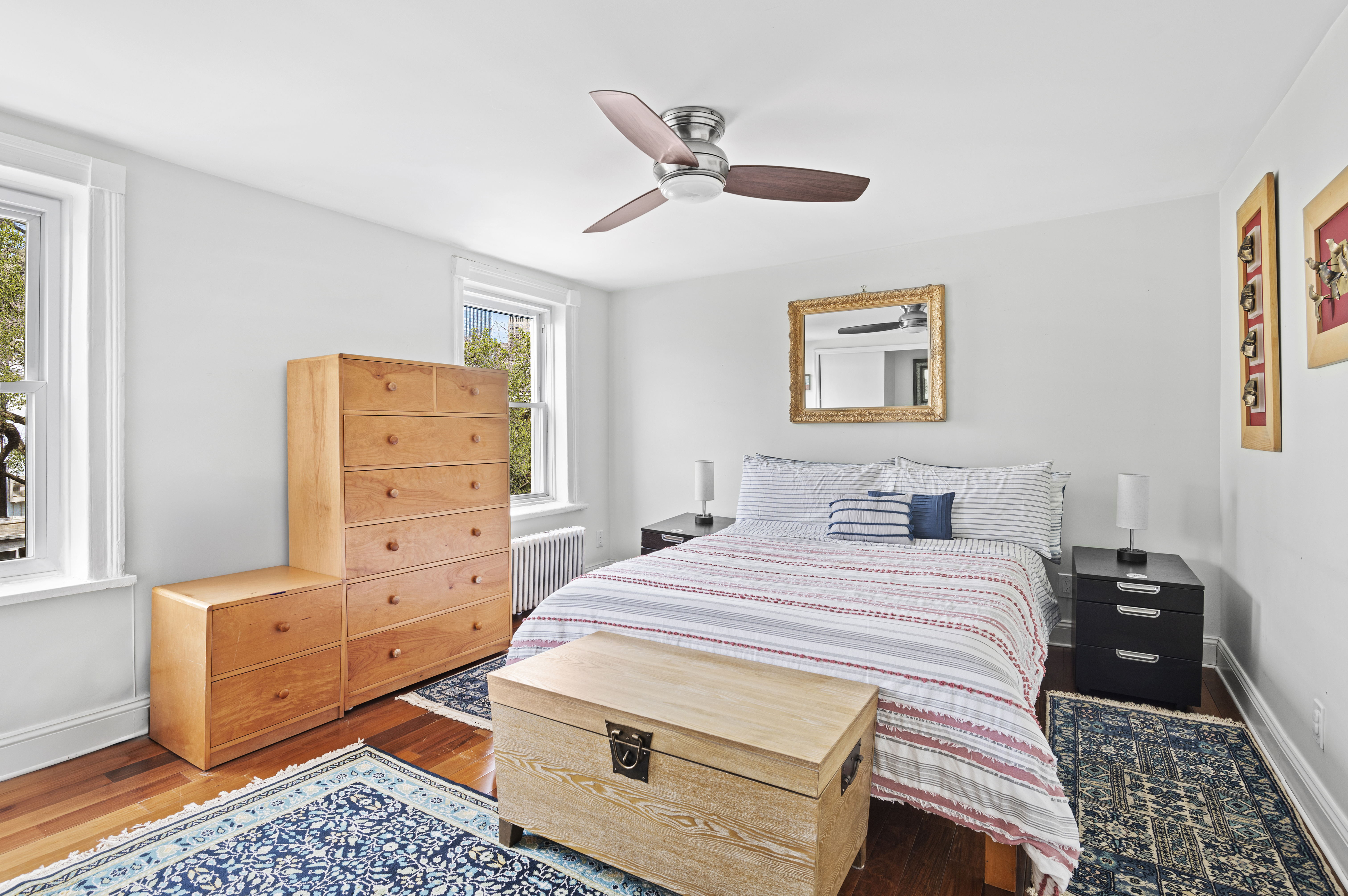 457 Warren Street Brooklyn, NY 11217 - Photo 10 of 16 a bedroom with a bed and wooden floor