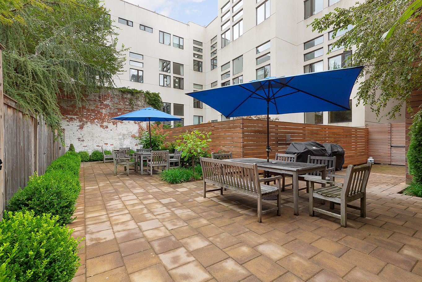 376 President Street, Unit 4D Brooklyn, NY 11231 - Photo 17 of 18 a view of a tables and chairs under an umbrella in backyard