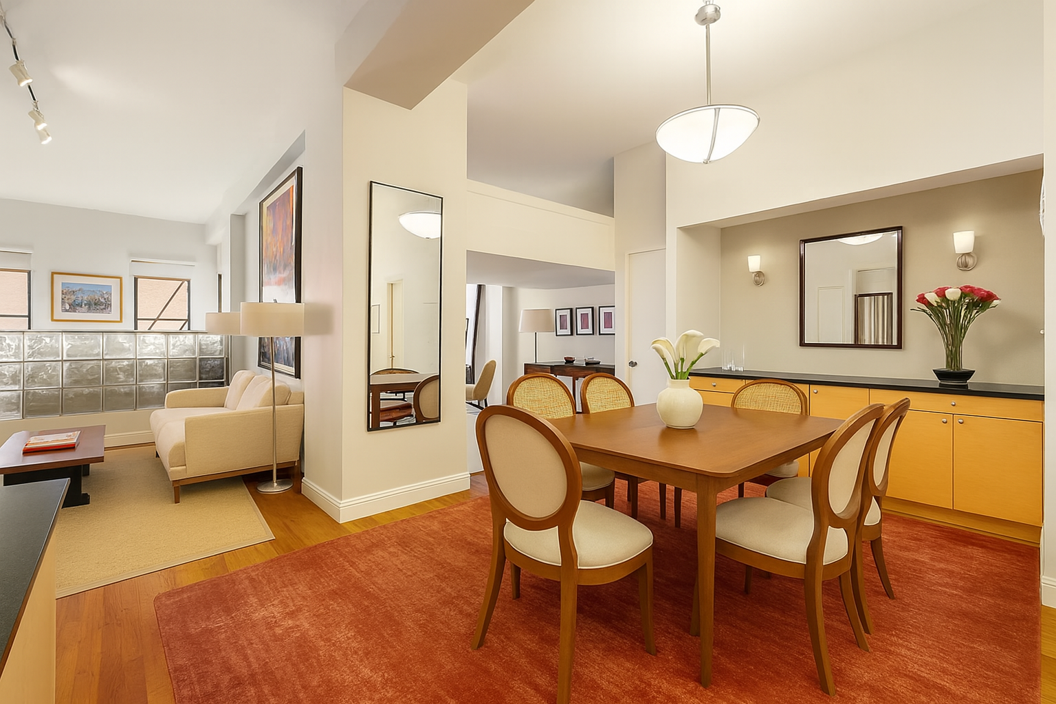 23 Waverly Place, Unit 5DE Manhattan, NY 10003 - Photo 2 of 16 a dining room with furniture and wooden floor
