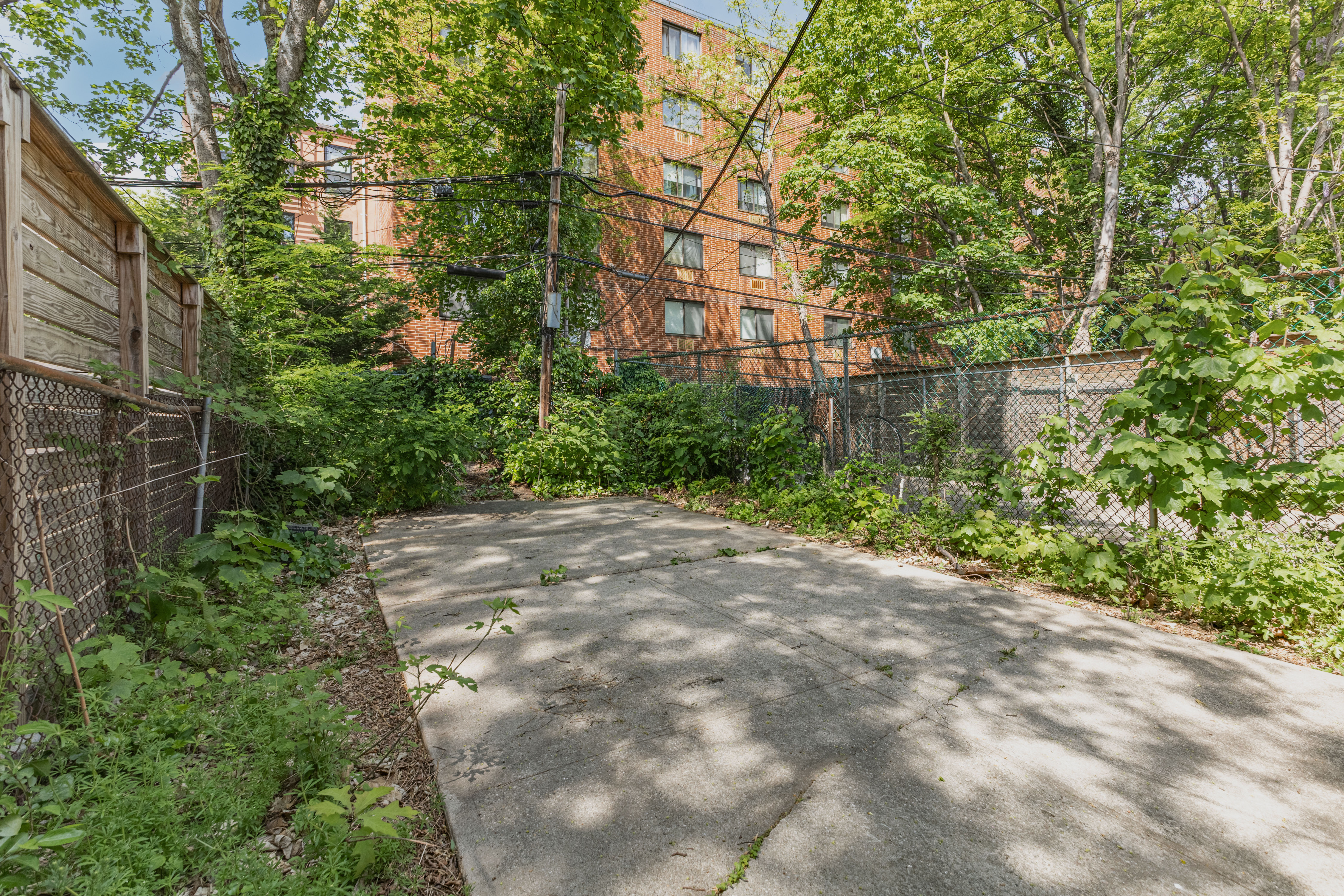 799 Willoughby Avenue Brooklyn, NY 11206 - Photo 7 of 12 a backyard of a house with lots of green space and lake view
