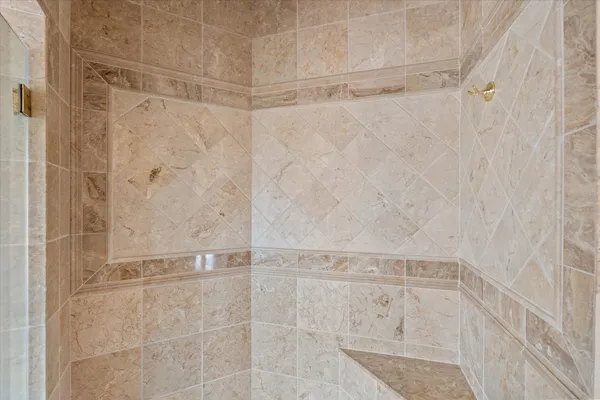 a picture of a bench in front of a wall