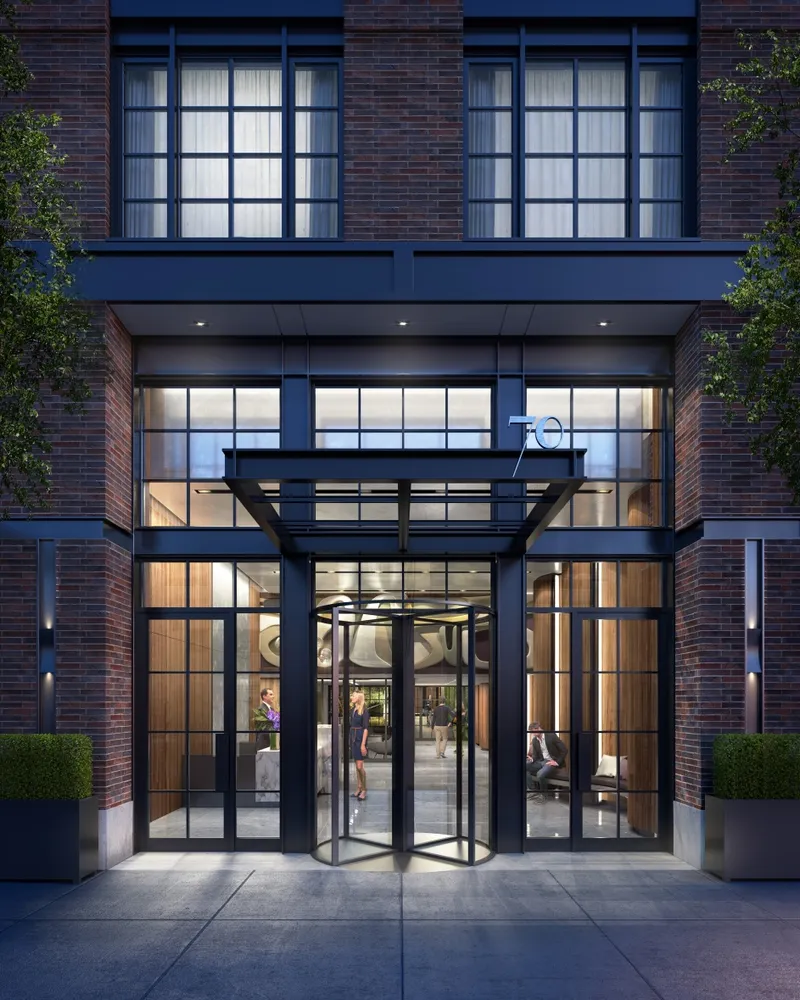 a view of porch with a large window and potted plants
