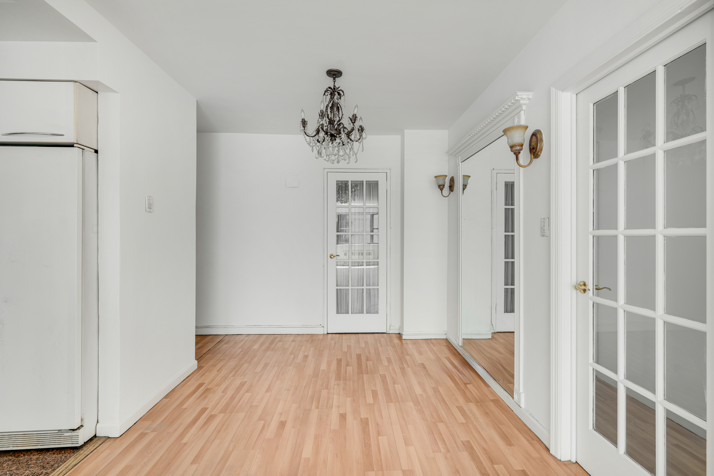 357 East 57th Street, Unit 5D Manhattan, NY 10022 - Photo 16 of 23 a view of a hallway with wooden floor and staircase