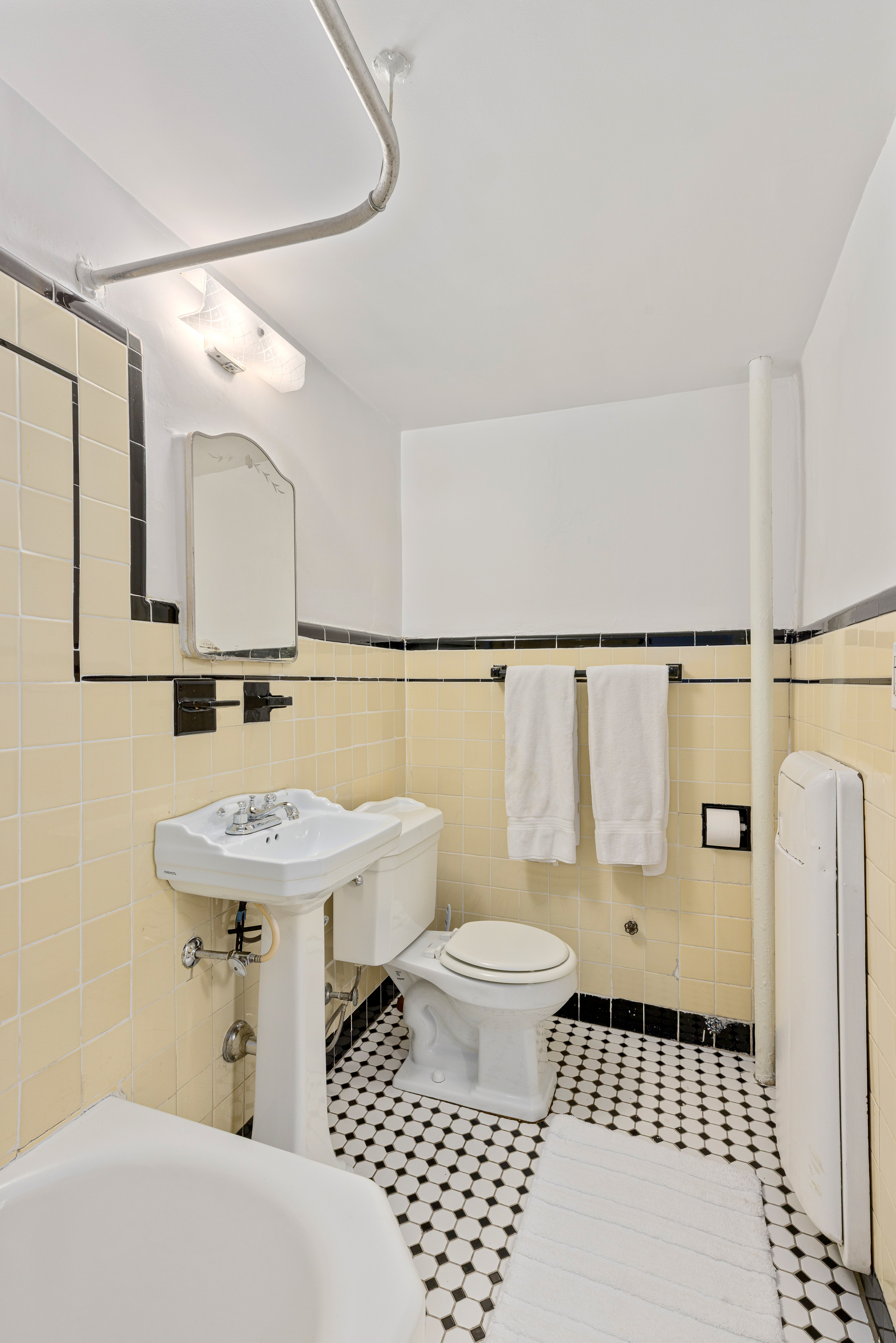 322 West 88th Street, Unit B Manhattan, NY 10024 - Photo 6 of 8 a bathroom with a sink toilet a mirror and shower