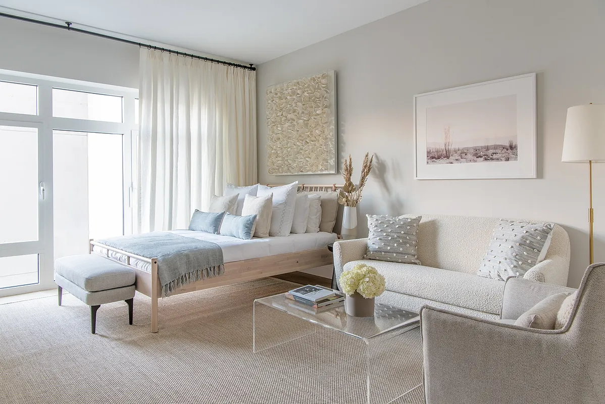 181 18th Street, Unit 301 Brooklyn, NY 11215 - Photo 1 of 13 a living room with furniture and a large window