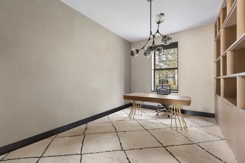 a dining room with a table and a window