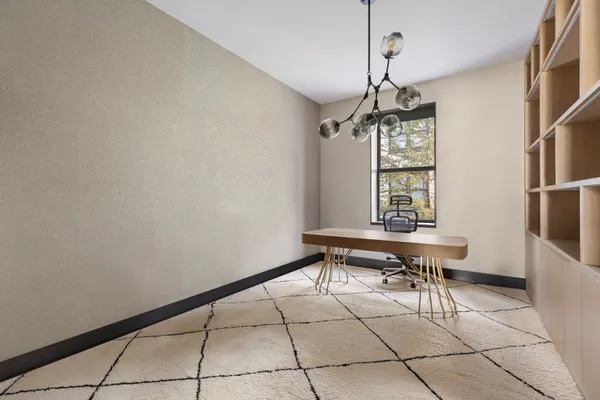 a dining room with a table and a window