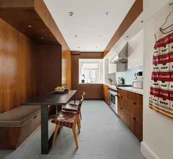 a kitchen with stainless steel appliances kitchen island granite countertop lots of counter top space and furniture