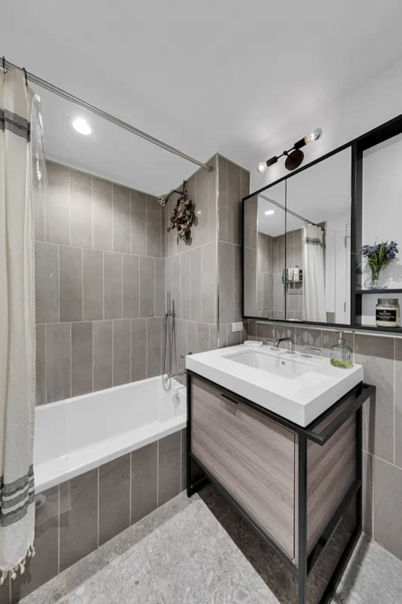 575 4th Avenue, Unit 3F Brooklyn, NY 11215 - Photo 9 of 20 a bathroom with a tub sink shower and mirror