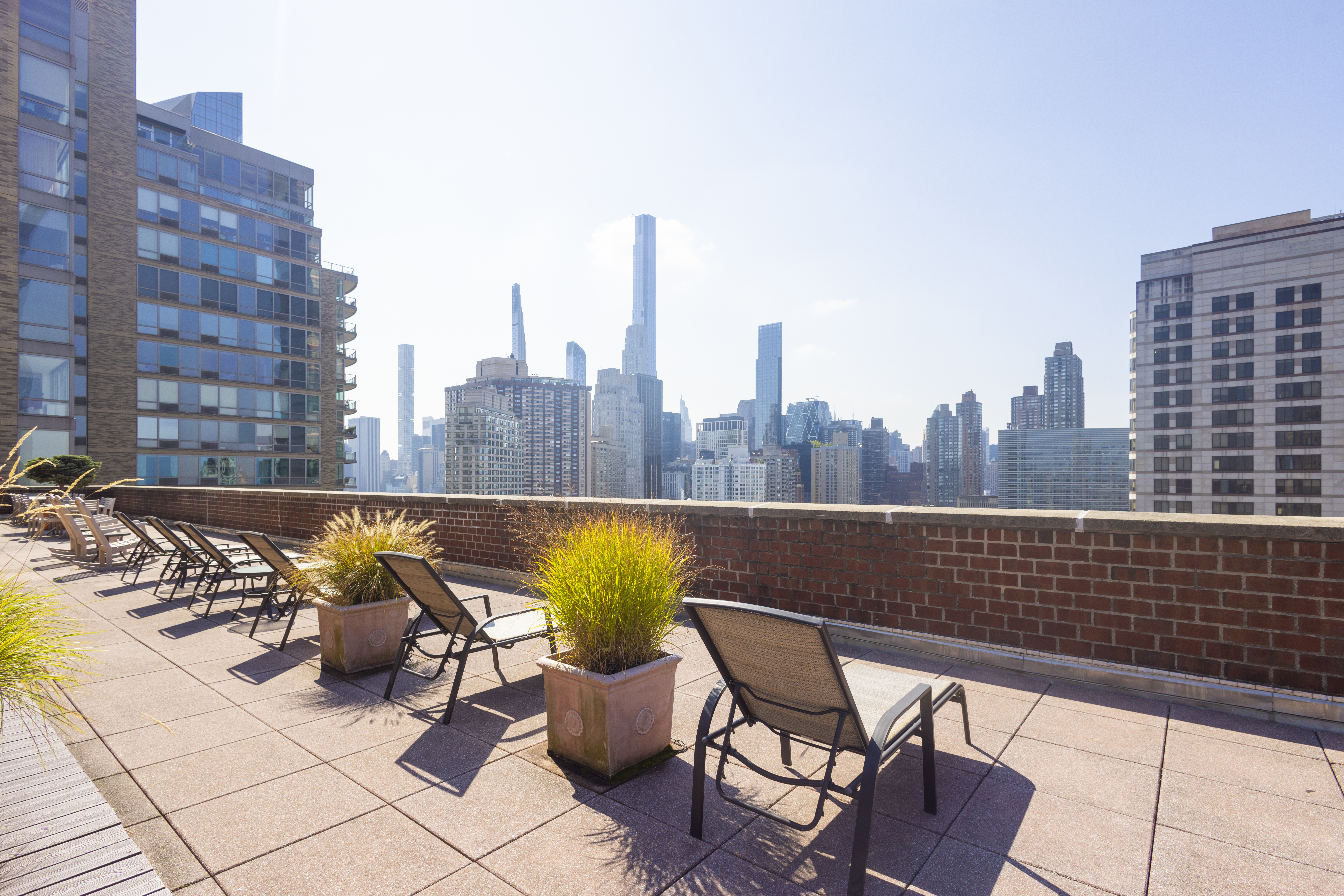 130 West 67th Street, Unit 26D Manhattan, NY 10023 - Photo 8 of 9 a view of swimming pool with outdoor seating and city view