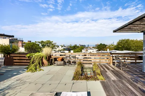 a view of a balcony with chairs