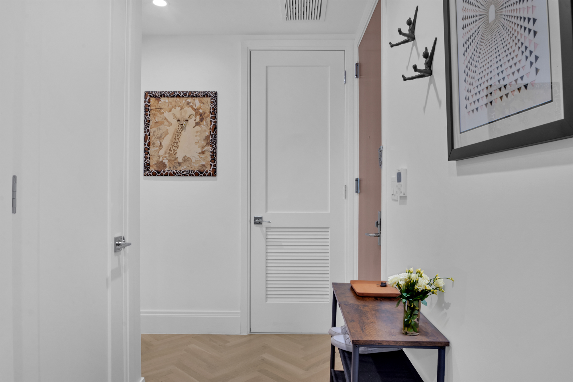 300 West 122nd Street, Unit 6R Manhattan, NY 10027 - Photo 5 of 23 a view of a hallway with paintings on the wall