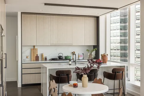 a kitchen with a sink cabinets and window