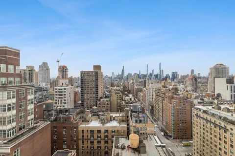 a view of city and a tall buildings