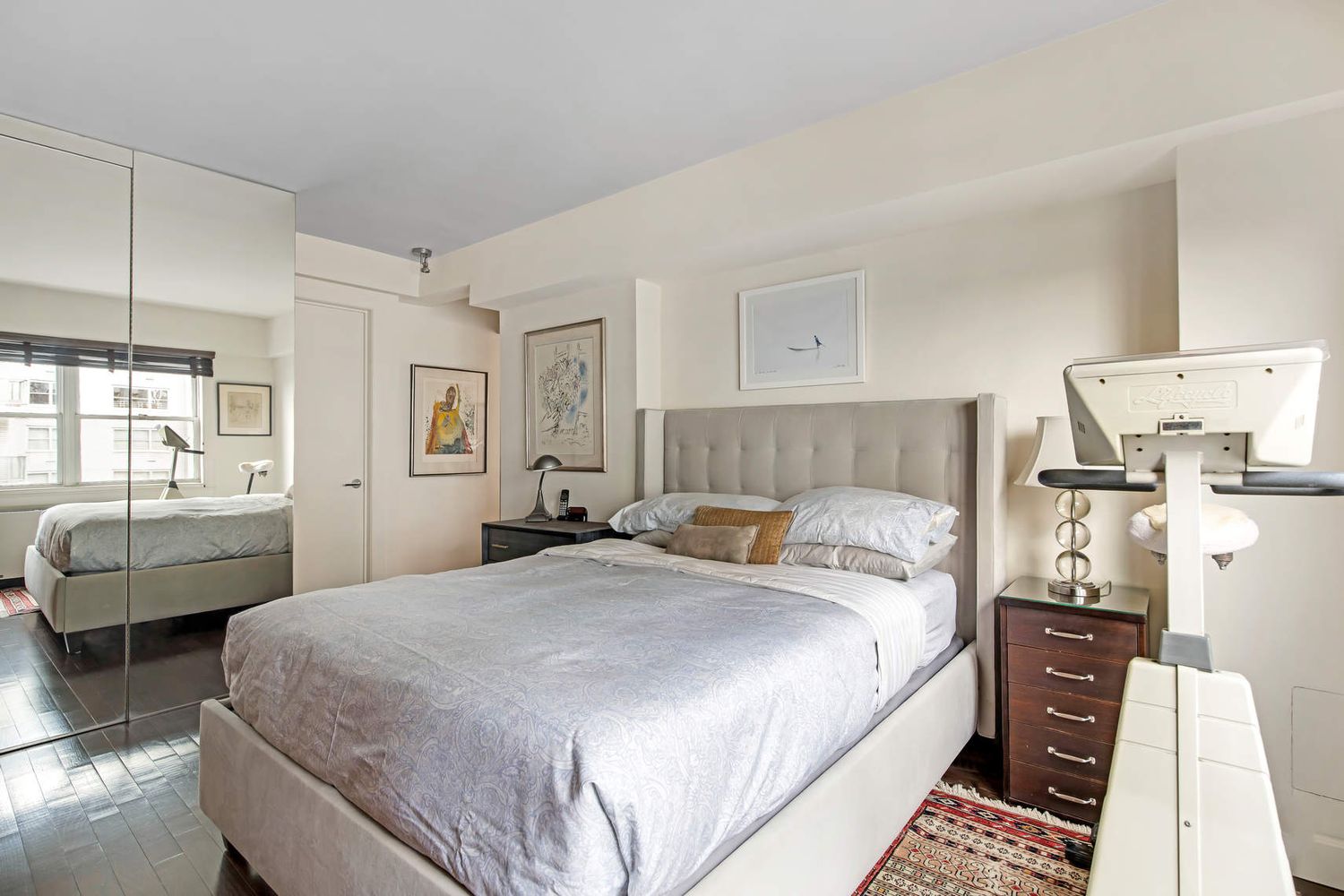 520 East 76th Street, Unit PHC Manhattan, NY 10021 - Photo 12 of 15 a bedroom with a bed and wooden floor