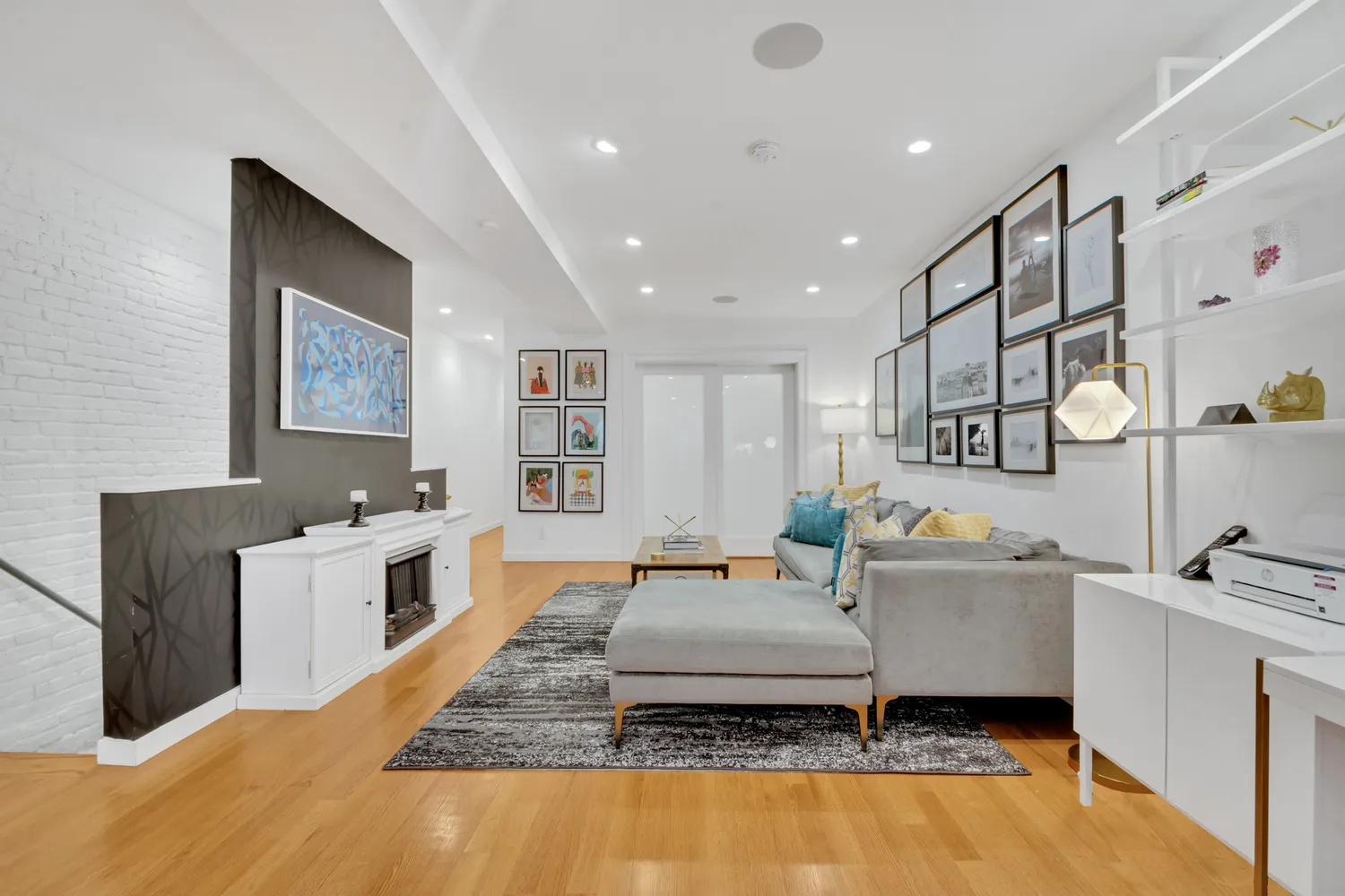a living room with a couch and dresser