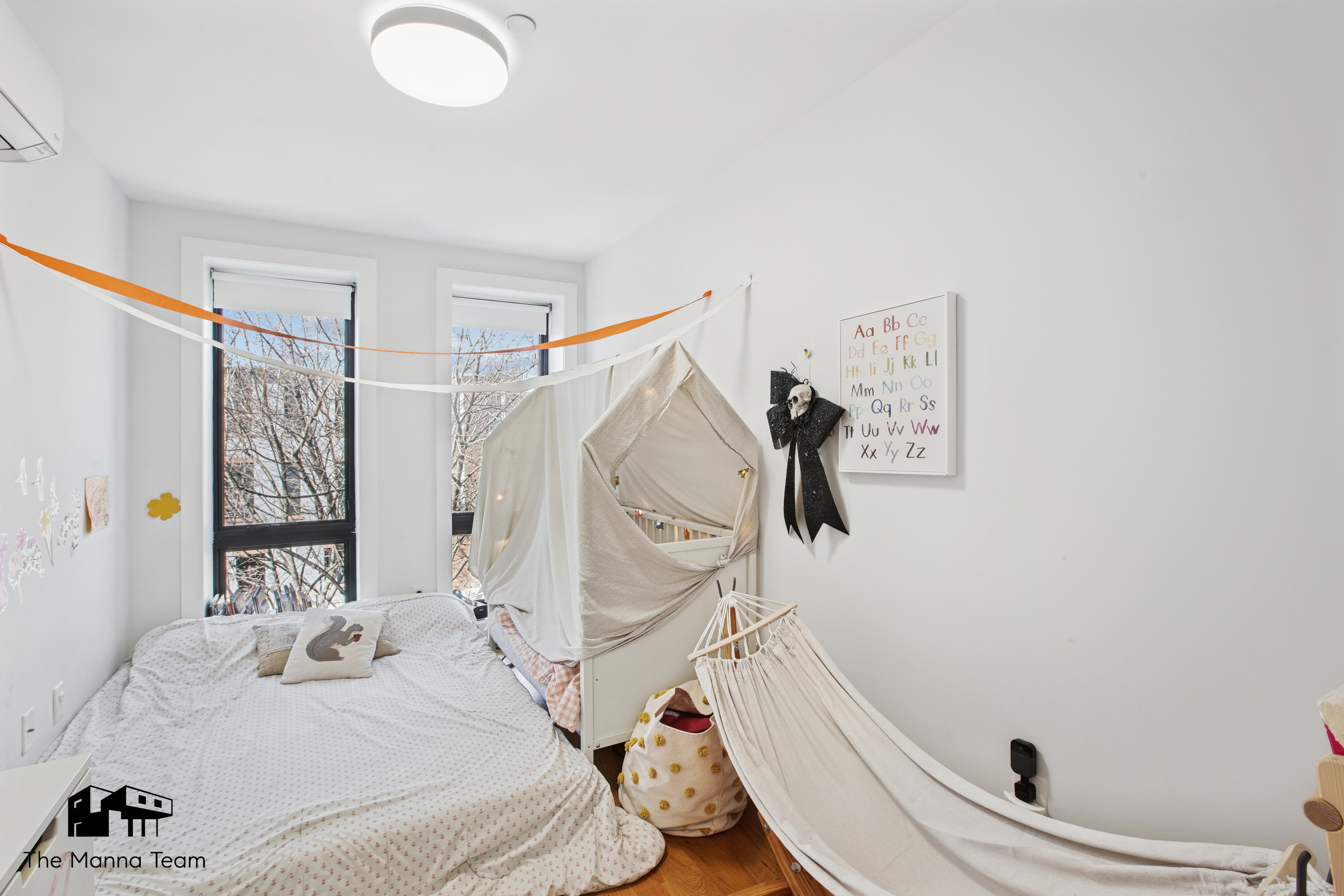 385 Jefferson Avenue, Unit C Brooklyn, NY 11221 - Photo 12 of 21 a bathroom with a sink a mirror and a shower